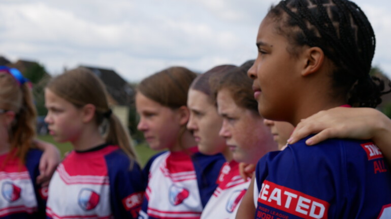 Image of several of our under 14 girls in a huddle.